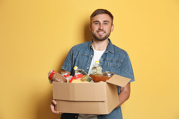 Man holding box of food